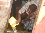 Lydia scoops out more water from her house3