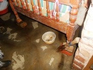 The floor in her bedroom is relatively dry because the cement there was put there in the dry season